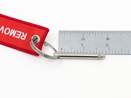 Weapon Lock Pin with Remove Before Fight Tag